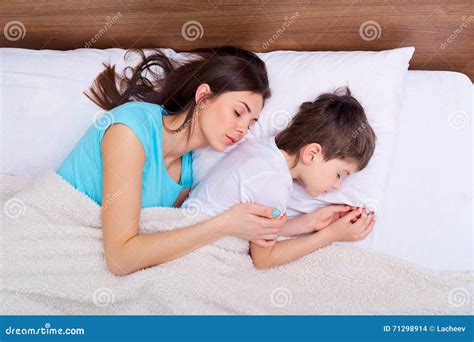 Mother And Son Sleeping In Bed stock videos and。